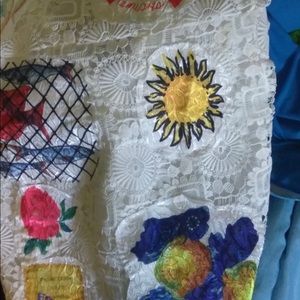 White dress with a lot of details on it